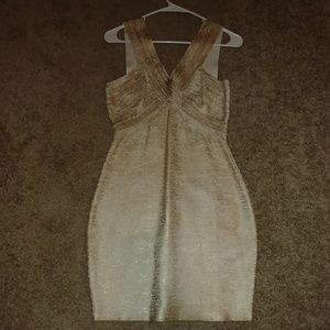 Gold and white bebe bandage dress.